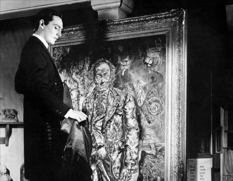 El bello joven contempla como envejece y se degrada su retrato con todos sus vicios